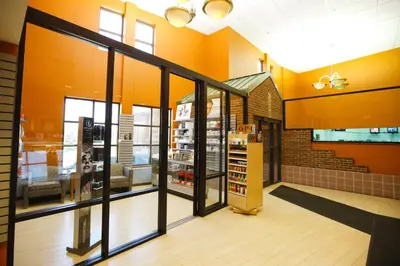 a store front with glass doors in a building at The Bertram Inn at Glenmoor in Canton