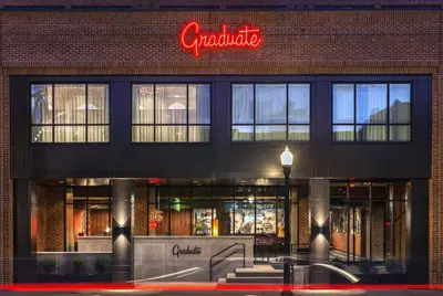 a store front of a building with a sign on it at Graduate by Hilton Columbus in Columbus