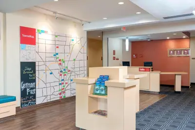 a lobby with a wall with a map at TownePlace Suites Fort Wayne North in Fort Wayne