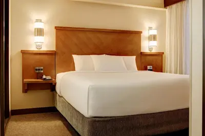 a large white bed in a hotel room at Hyatt Place Fort Wayne - Northwest in Fort Wayne