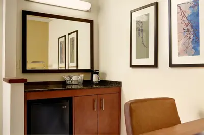 a bathroom with a sink and a mirror at Hyatt Place Fort Wayne - Northwest in Fort Wayne
