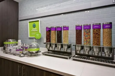 a kitchen counter with a bunch of cereals at Tru By Hilton Huber Heights Dayton in Huber Heights