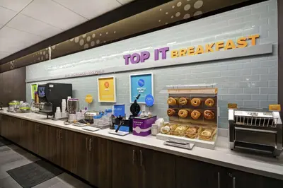 a top it breakfast counter in a donut shop at Tru By Hilton Huber Heights Dayton in Huber Heights