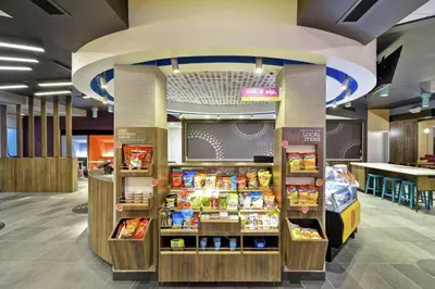 a store with a food counter in a mall at Tru By Hilton Huber Heights Dayton in Huber Heights