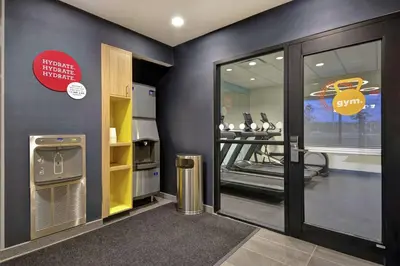 a fitness room with a treadmill and a gym at Tru By Hilton Mason King's Island in Mason