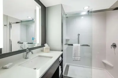 a white bathroom with a sink and a shower at Hilton Garden Inn Pittsburgh Area Beaver Valley, Pa in Monaca