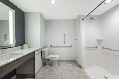 a white bathroom with a toilet and a sink at Hilton Garden Inn Pittsburgh Area Beaver Valley, Pa in Monaca