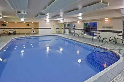 a large swimming pool in a hotel room at Country Inn & Suites by Radisson, Marion, OH in Marion