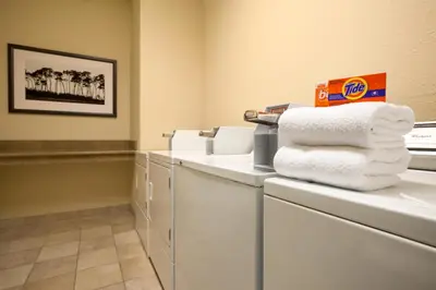 a pile of towels sitting on a counter in a room at Country Inn & Suites by Radisson, Marion, OH in Marion