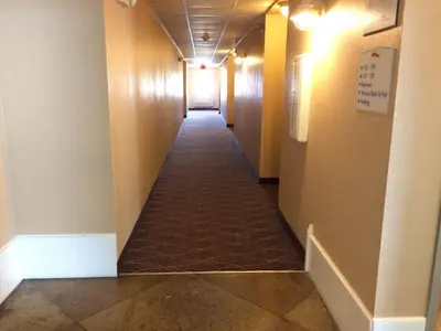 a long hallway with a long hallwayngth at Baymont by Wyndham Lawrenceburg in Lawrenceburg