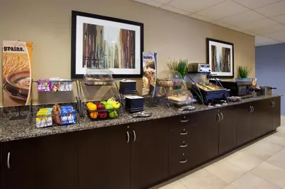 a counter with some food on top of it at Microtel Inn & Suites by Wyndham Waynesburg in Waynesburg