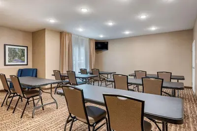a conference room with tables and chairs in it at Comfort Inn & Suites Northern Kentucky in Wilder