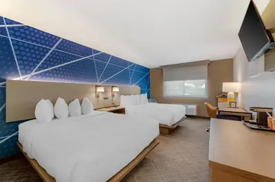a hotel room with two beds and a tv at Comfort Inn River's Edge in Huron
