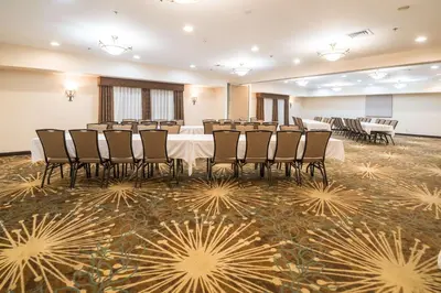 a conference room with a table and chairs in it at Hampton Inn Tiffin in Tiffin