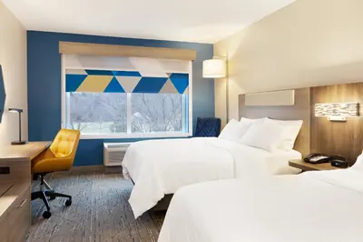a hotel room with two beds and a window at Holiday Inn Express Hotel & Suites Van Wert by IHG in Van Wert