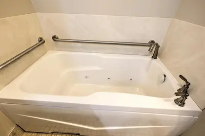 a white bath tub in a bathroom at Berlin Resort in Millersburg
