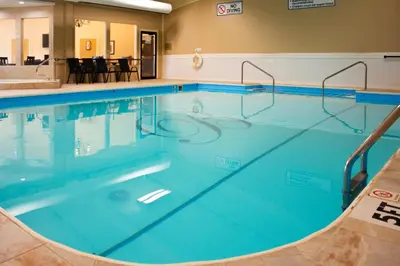 a large swimming pool with blue water at Berlin Resort in Millersburg