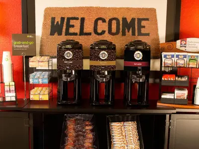 a store with a welcome sign on a counter at Extended Stay America Suites - Cleveland - Middleburg Heights in Middleburg Heights