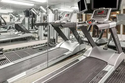 a gym with two treadmill machines at Baymont by Wyndham Cambridge in Cambridge
