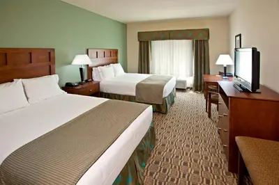 a hotel room with two beds and a flat screen tv at Holiday Inn Express & Suites Ripley by IHG in Ripley