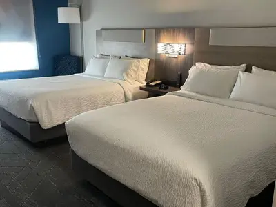 a hotel room with two beds and a window at Holiday Inn Express & Suites Ripley by IHG in Ripley
