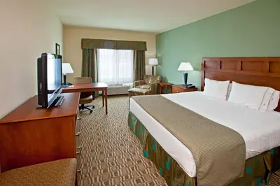 a hotel room with a bed and a television at Holiday Inn Express & Suites Ripley by IHG in Ripley