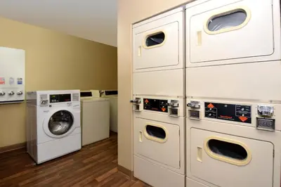 a laundry room with a washer and dryer at Extended Stay America Suites - Cincinnati - Blue Ash - Reagan Hwy in Blue Ash