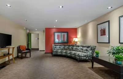 a living room with a couch and a television at Extended Stay America Suites - Dayton - South in Dayton