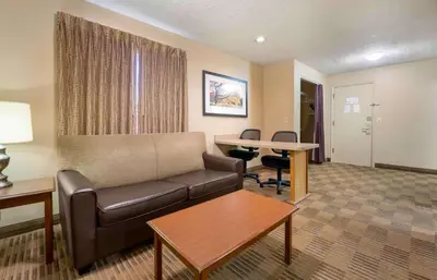 a living room with a couch and a table at Extended Stay America Suites - Dayton - South in Dayton