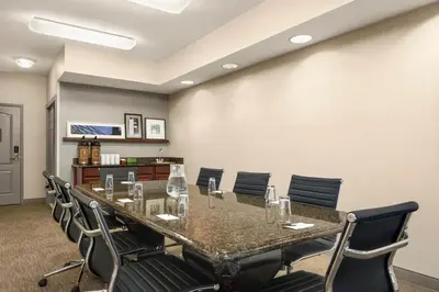 a conference room with a long table and chairs at Country Inn & Suites by Radisson, Lima in Lima