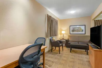a living room with a couch and chairs in a room at Studio 6 Extended stay Fairfield, OH - Cincinnati in Fairfield