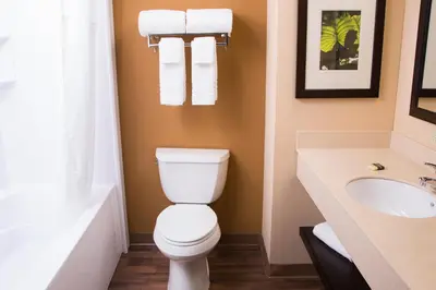 a bathroom with a toilet and a sink at Studio 6 Extended stay Fairfield, OH - Cincinnati in Fairfield