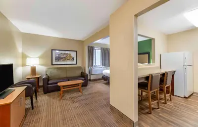a living room with a couch and a desk in a hotel room at Extended Stay America Suites - Cleveland - Westlake in Westlake