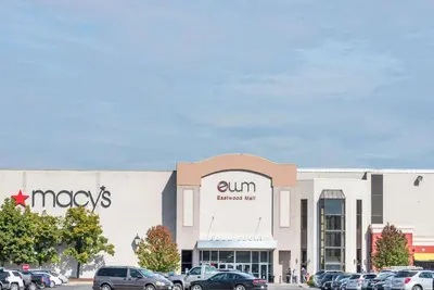 a store with cars parked in a parking lot at Days Inn by Wyndham Niles in Niles