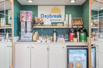 a kitchen with a counter with food on it at Days Inn by Wyndham Niles in Niles