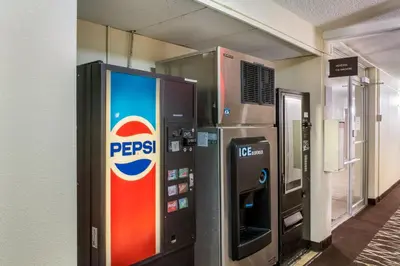 a pepsi vending machine next to a building at Red Roof Inn Richmond, IN in Richmond