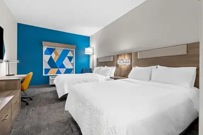 a hotel room with two beds and a tv at Holiday Inn Express Washington Court House by IHG in Washington Court House