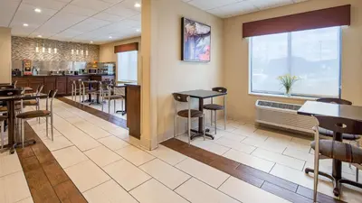 a dining room with tables and chairs in a restaurant at Best Western B R Guest in Zanesville