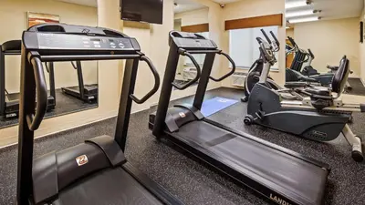 a gym with two tread machines and a treadmill at Best Western B R Guest in Zanesville