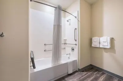 a bathroom with a tub and a shower at Comfort Suites Marysville Columbus - Northwest in Marysville