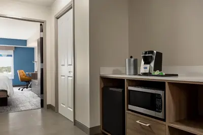 a kitchen with a microwave on a counter top at Holiday Inn Express & Suites North Fremont by IHG in Fremont