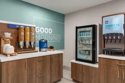 a store with a good warning sign and a refrigerator at Holiday Inn Express & Suites North Fremont by IHG in Fremont