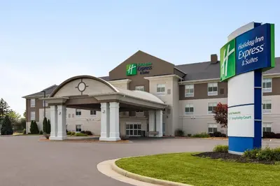 a hotel with a sign in front of a building at Holiday Inn Express & Suites North Fremont by IHG in Fremont