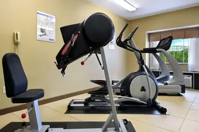a room with a gym with two exercise bikes at Microtel Inn & Suites by Wyndham Marietta in Marietta
