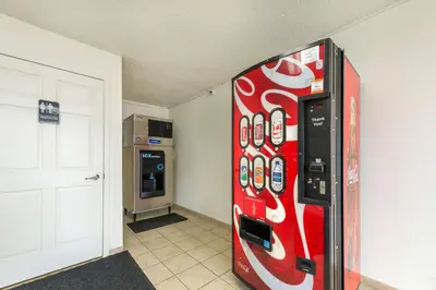 a cocacola soda machine is in a room at Motel 6-Troy, OH in Troy