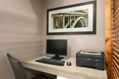 a desk with a computer and a printer at Country Inn & Suites by Radisson, Columbus Airport, OH in Columbus