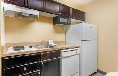a kitchen with a white refrigerator and a sink at Extended Stay America Suites - Columbus - Tuttle in Dublin