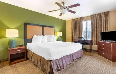 a hotel room with a bed and a ceiling fan at Extended Stay America Suites - Columbus - Tuttle in Dublin
