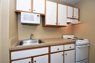 a small kitchen with a sink and a microwave at Extended Stay America Suites - Pittsburgh - Airport in Imperial