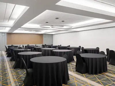 a conference room with black tables and chairs at Holiday Inn Portsmouth Downtown by IHG in Portsmouth